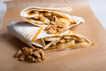 Sweet wrap stuffed with nuts, fruits, marshmallow