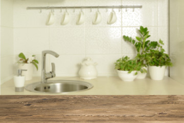 Wooden table top on blur interior background