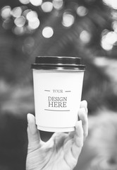 Closeup of hand holding paper cup