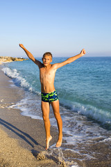 teenager jumping on the seashore.joy. fun. emotions.Summer vacation,