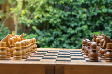 wooden chess board with wooden chess pieces