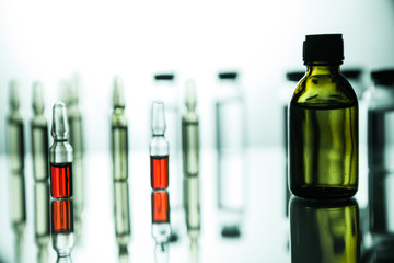 Group of ampoules with a transparent medicine in medical laboratory