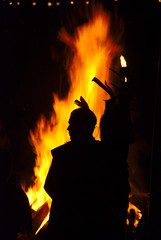 Fototapeta na wymiar Silhouette of an Indian at a campfire
