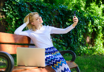 Girl freelancer successful blogger work on internet project streaming video. Creating new content...