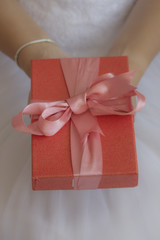 Bride holding her red gift box