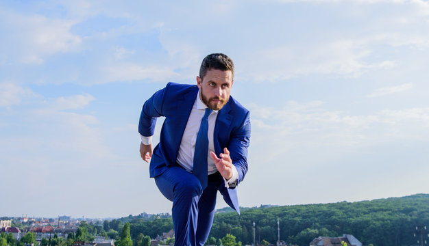 Towards Success. Businessman Formal Suit Run Outdoors Blue Sky Background. Man Concentrated Focused On Business Achievement. Business As Marathon Or Sprint. Entrepreneur Run For Success