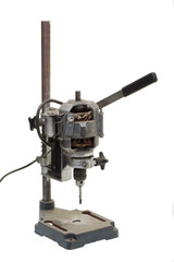 Old vertical drilling machine isolated on white