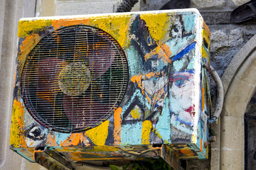 Obraz na płótnie Canvas Urban designed air conditioner in the street