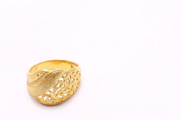 Beautiful gold ring on white background