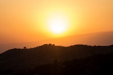 Fototapeta premium Yellow sun and mountains