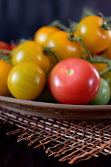 Tomatoes of different sorts and colours on a plate
