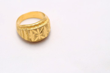 Beautiful gold ring on white background