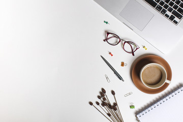 Flat lay workspace picture, cup of coffee, notebook and pen on white background. Business workplace concept. Work desktop with coffee, enjoy working.