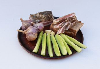 Dish with snack on white background