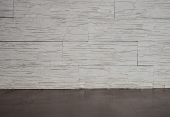 Wall made of stone and wooden floor