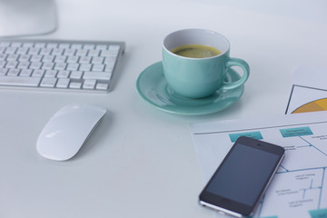 A cup of coffee on the office table