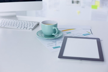 Fototapeta premium A cup of coffee on the office table