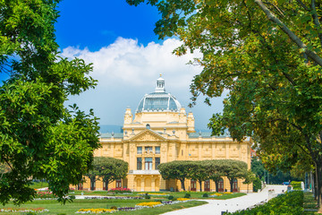 Zagreb, Croatia, art pavilion and trees in beautiful summer day, colorful 19 century architecture 