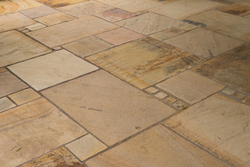 Lime-sandstone slabs laid irregularly on the terrace