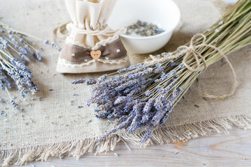 Dried lavender and sacks on wooden table