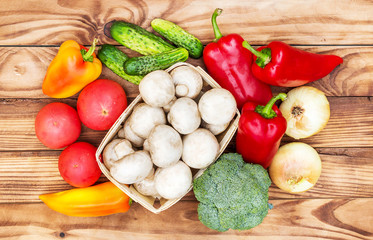 Heap of different vegetables on the wooden table. Top view.