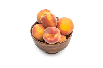 Bowl with peaches on white background.