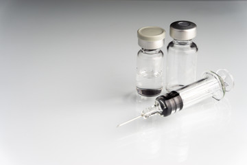 Syringe and vials closeup with selective focus and crop fragment. Medical and Healthcare Concept