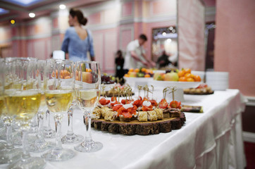 On the holiday table there are glasses of champagne.