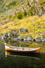Boats moored on calm water. Lofoten island - Norway.