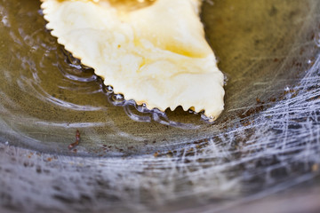 Uzbek cheburek fried in oil in a vat