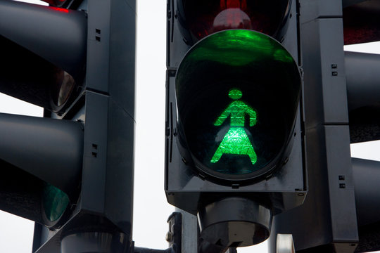The silhouette of a woman in a traffic light as a sign of gender equality