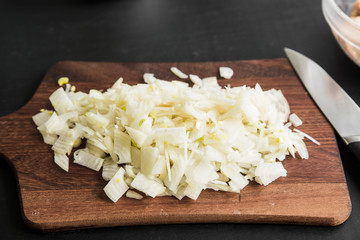 Sliced onion on a wooden board, closeup