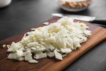 Sliced onion on a wooden board, closeup
