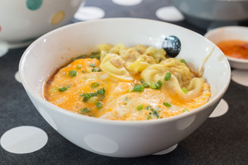 Wonton with boil egg in spicy soup