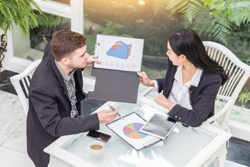 business man and woman meeting to discuss idea and looking in sale report,Business Startup Concept