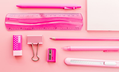 pink stationery on pink background top view flat lay