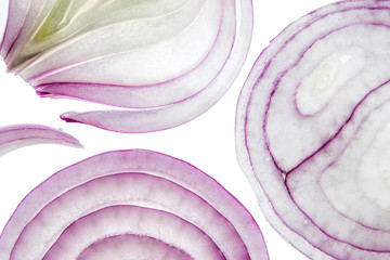 Sliced red onion rings on white background top view macro