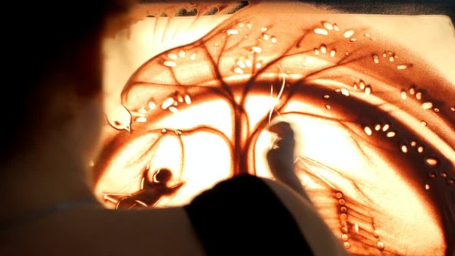 Drawing with sand. Drawing sand on a screen. Sand Artist. Hands draws. Animation
