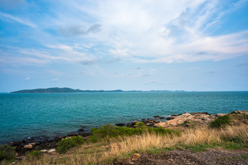 Sea rocks with wave on sunset