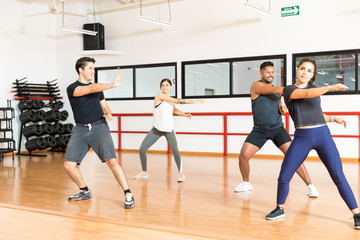 Fototapeta na wymiar Multiethnic Friends Dancing Together In Gym