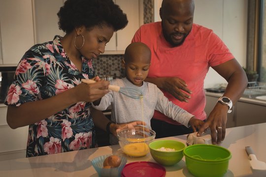 Family Preparing Food In The Kitchen