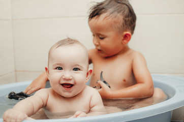 children, brother and sister in the bathroom