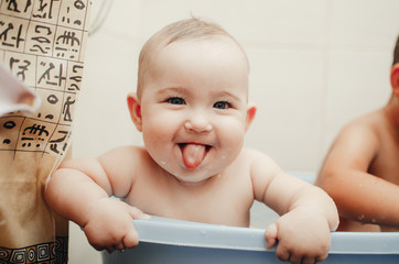 children, brother and sister in the bathroom