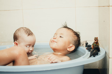 children, brother and sister in the bathroom