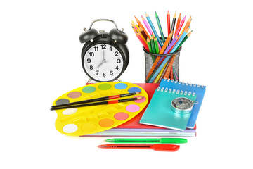 Education workspace background concepts. Pencil, stationery, Book, alarm clock and other school supplies isolated on white background.