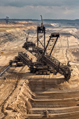 Excavator Mining In A Brown Coal Open Pit Mine.