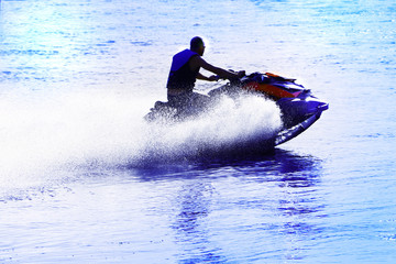 a man is riding a jetski on the water