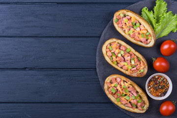 Baked potato with sausage