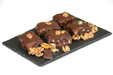 Chocolate raw vegan cake with nuts, figs and carob. Love for a healthy raw food concept.