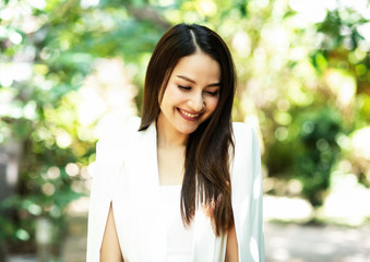 Fototapeta premium The beauty is smiling and turn face down,shyly emotion,blurry light around.